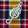 Celtic Treble Clef Silver Brooch on Jacobite Tartan