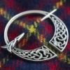 Celtic Penannular Brooch on Tartan