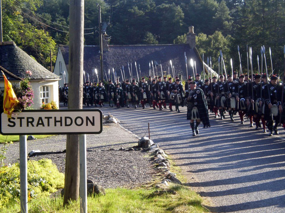 Lonach Highlanders marching through Strathdon, Aberdeenshire.